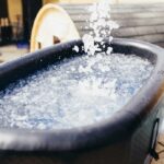 ALT TEXT:
Cold plunge tub filled with ice water for BJJ recovery and inflammation management