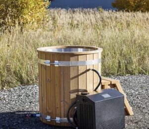 Cold plunge tub and water chiller setup outdoors for BJJ recovery training