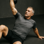  BJJ grappler performing thoracic spine mobility exercise for shoulder and upper-back movement